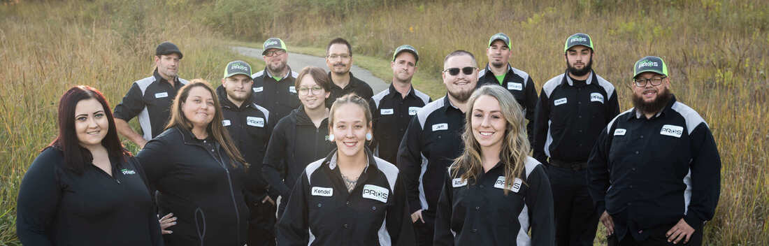A group photo of the Pest Pros team in uniform.